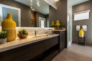 A stylish bathroom with dark-colored European style cabinets 